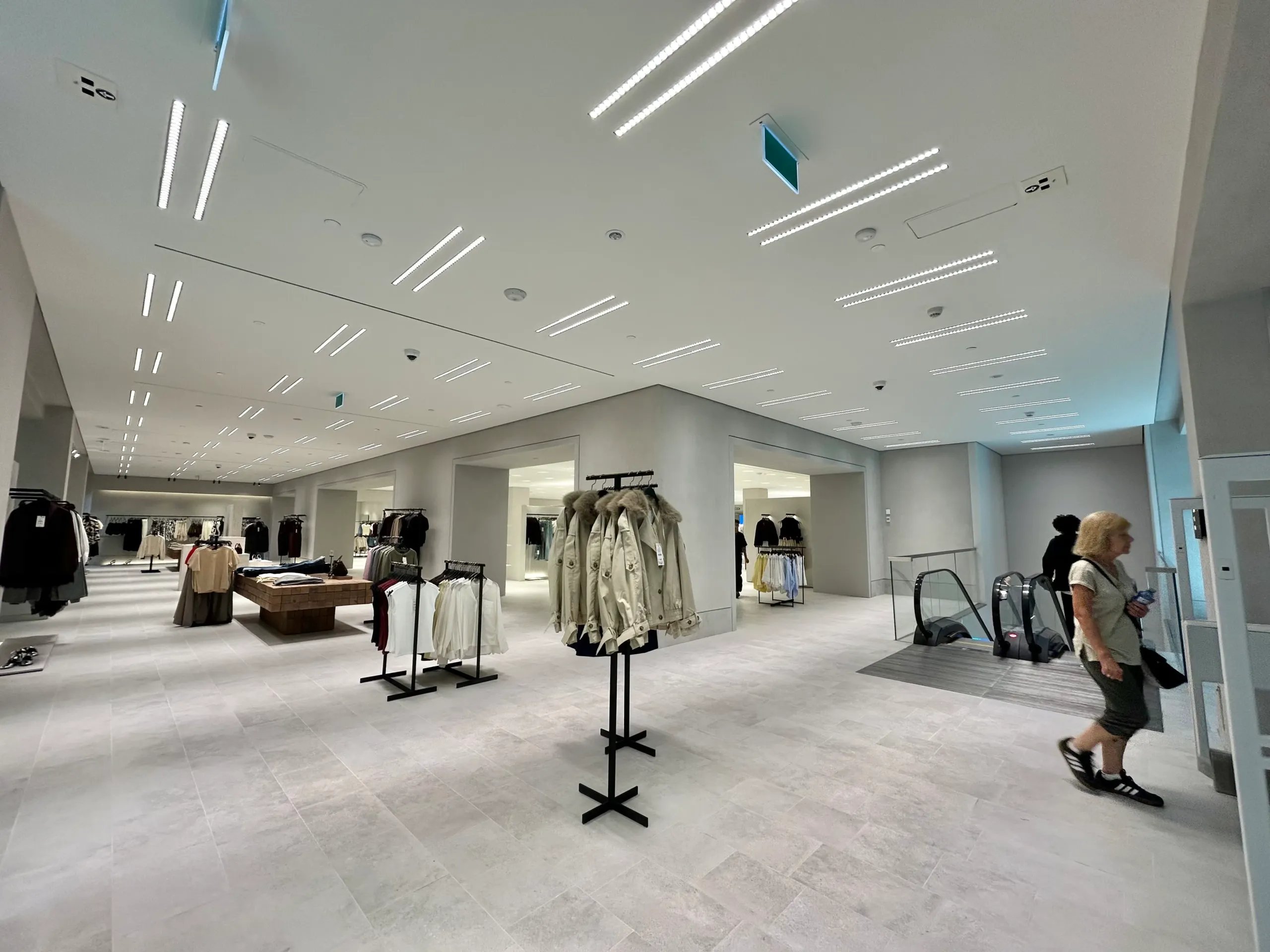 Commercial lighting installation at Zara in Square One, completed by Pro Force Electric. Modern ceiling lighting system designed to enhance the retail shopping experience.